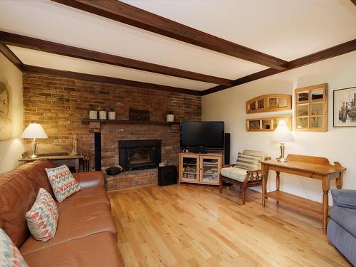 Family room - 188 Rue Fairhaven, Hudson, QC - Indoor Photo Showing Living Room With Fireplace