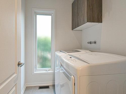 Salle de lavage - 162 Rue De Fontenelle, Blainville, QC - Indoor Photo Showing Laundry Room