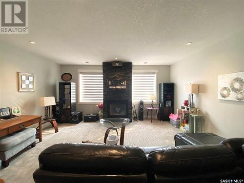 224 Valley Meadow Court, Swift Current, SK - Indoor Photo Showing Living Room With Fireplace