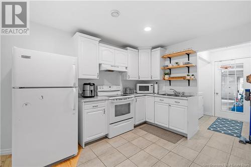 278-280 Des Breau, Cocagne, NB - Indoor Photo Showing Kitchen With Double Sink