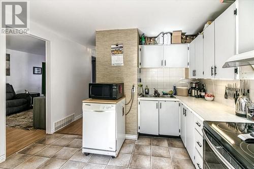 23 Racicot, Greater Sudbury, ON - Indoor Photo Showing Kitchen With Double Sink