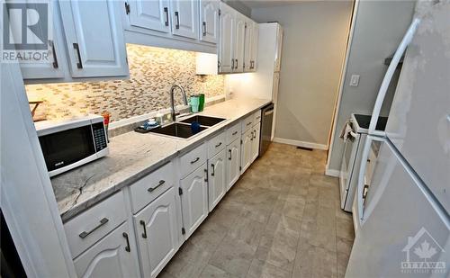 Updated Galley Kitchen - 5 Oran Avenue, Cornwall (717 - Cornwall), ON - Indoor Photo Showing Kitchen With Double Sink