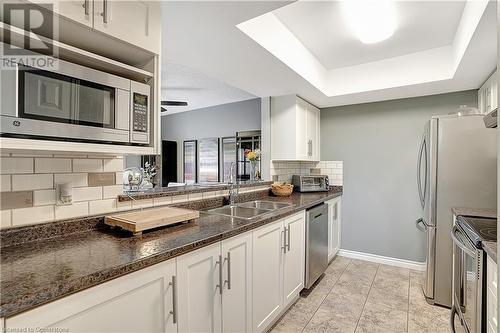 Updated s/s appliances - 15 Gregg Court Unit# 1, Kitchener, ON - Indoor Photo Showing Kitchen With Double Sink