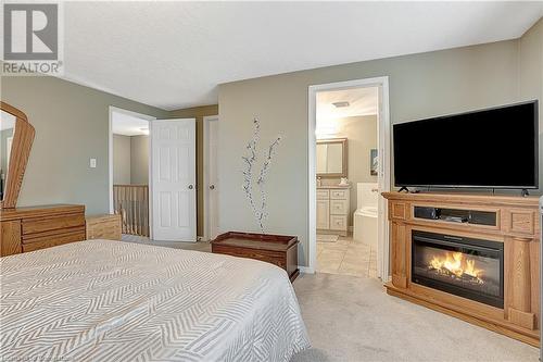 15 Gregg Court Unit# 1, Kitchener, ON - Indoor Photo Showing Bedroom With Fireplace