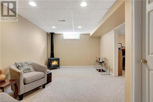 Professionally finished basement with gas fireplace - 15 Gregg Court Unit# 1, Kitchener, ON - Indoor Photo Showing Basement