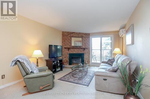 224 - 440 Wellington Street, St. Thomas, ON - Indoor Photo Showing Living Room With Fireplace