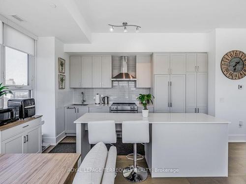 702-1063 Douglas Mccurdy Comm, Mississauga, ON - Indoor Photo Showing Kitchen With Upgraded Kitchen