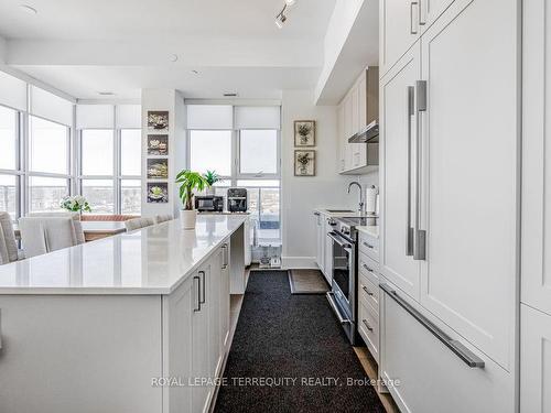 702-1063 Douglas Mccurdy Comm, Mississauga, ON - Indoor Photo Showing Kitchen With Upgraded Kitchen