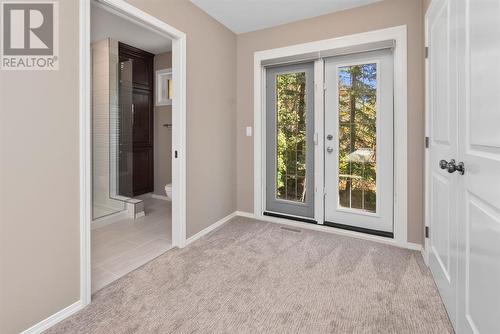 Primary bedroom window doors lead to what can be a primary bedroom balcony if buyers decide to develop it - 209, 27475 Township Road 380, Rural Red Deer County, AB 