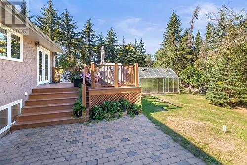 Back patio and view of composite deck - 209, 27475 Township Road 380, Rural Red Deer County, AB 