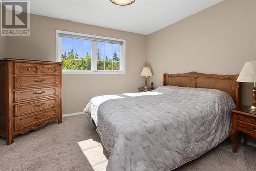 Primary bedroom on the upper level - 209, 27475 Township Road 380, Rural Red Deer County, AB 