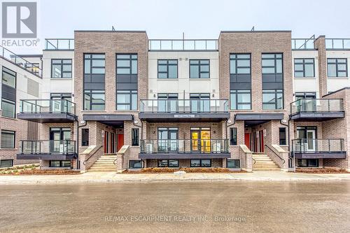 105 - 1577 Rose Way, Milton, ON - Outdoor With Balcony With Facade