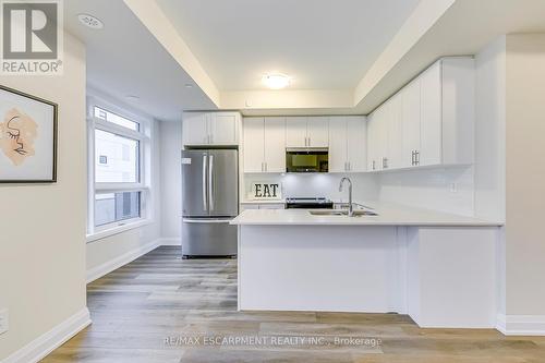 105 - 1577 Rose Way, Milton, ON - Indoor Photo Showing Kitchen With Stainless Steel Kitchen