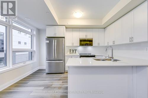 105 - 1577 Rose Way, Milton, ON - Indoor Photo Showing Kitchen With Stainless Steel Kitchen