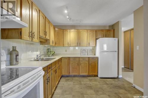 304 2727 Victoria Avenue, Regina, SK - Indoor Photo Showing Kitchen With Double Sink