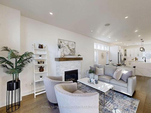 19 Johnston St, St. Catharines, ON - Indoor Photo Showing Living Room With Fireplace