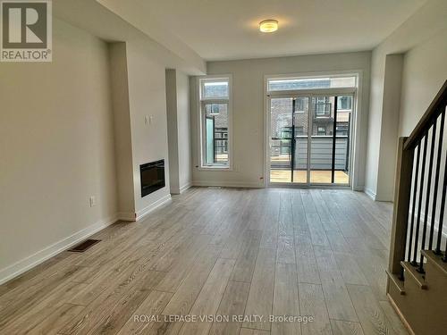 18 Akil Thomas Gardens, Toronto, ON - Indoor With Fireplace