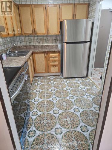 601 - 3390 Weston Road, Toronto, ON - Indoor Photo Showing Kitchen With Stainless Steel Kitchen With Double Sink