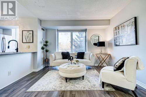 307 - 1730 Eglinton Avenue E, Toronto, ON - Indoor Photo Showing Living Room