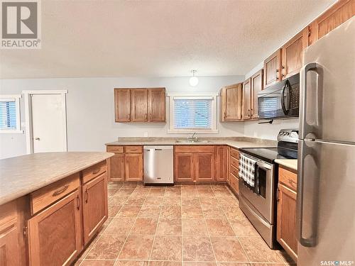 203 Cross Street N, Outlook, SK - Indoor Photo Showing Kitchen With Double Sink