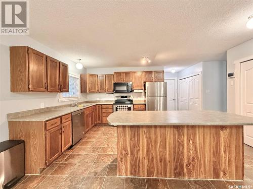 203 Cross Street N, Outlook, SK - Indoor Photo Showing Kitchen With Double Sink