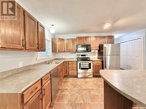 203 Cross Street N, Outlook, SK - Indoor Photo Showing Kitchen With Double Sink