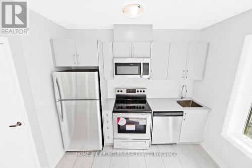 202 - 400 The East Mall, Toronto, ON - Indoor Photo Showing Kitchen With Stainless Steel Kitchen