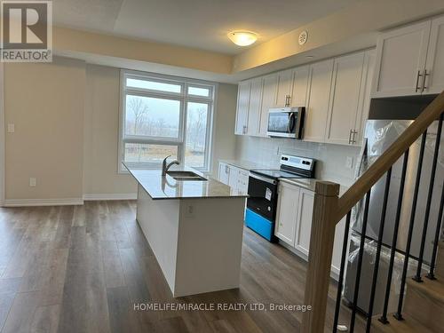 416 - 1577 Rose Way, Milton, ON - Indoor Photo Showing Kitchen