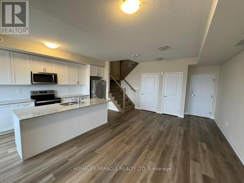 416 - 1577 Rose Way, Milton, ON - Indoor Photo Showing Kitchen With Double Sink