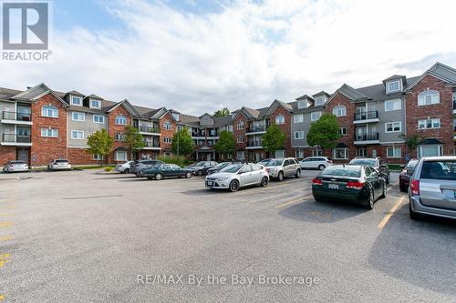 211 - 16 Westbury Road, Wasaga Beach, ON - Outdoor With Facade