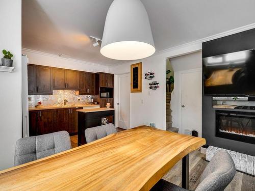 Vue d'ensemble - 232 Rue Desjardins, Sainte-Agathe-Des-Monts, QC - Indoor Photo Showing Dining Room With Fireplace