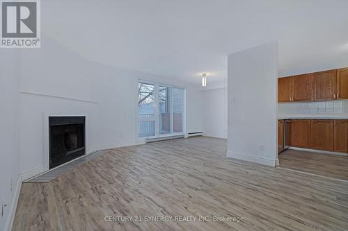 403 - 1589 St Bernard Street, Ottawa, ON - Indoor Photo Showing Living Room With Fireplace