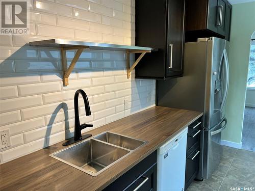 1307 11Th Street W, Saskatoon, SK - Indoor Photo Showing Kitchen With Double Sink