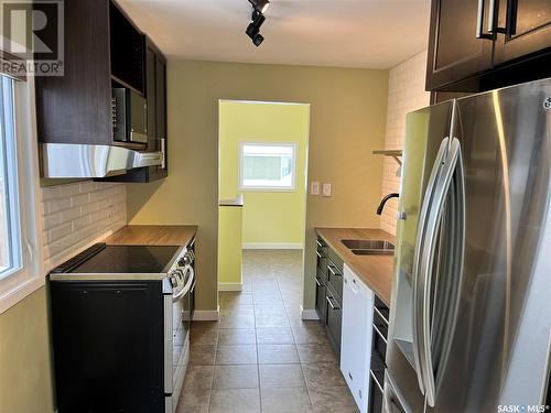 1307 11Th Street W, Saskatoon, SK - Indoor Photo Showing Kitchen With Double Sink