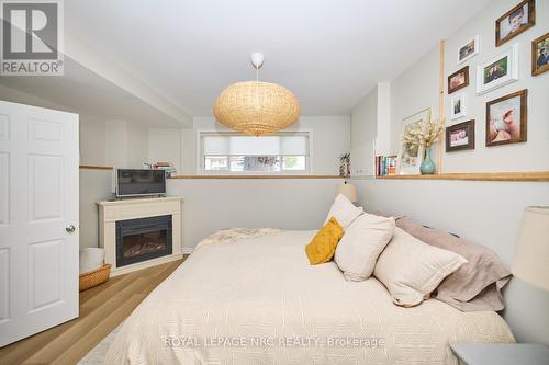 247 Humboldt Parkway, Port Colborne (875 - Killaly East), ON - Indoor Photo Showing Bedroom With Fireplace