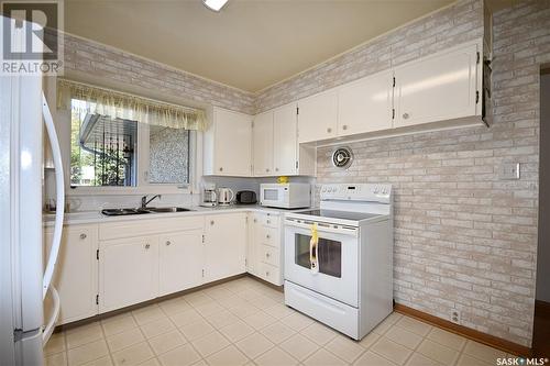 253 25Th Street W, Prince Albert, SK - Indoor Photo Showing Kitchen With Double Sink