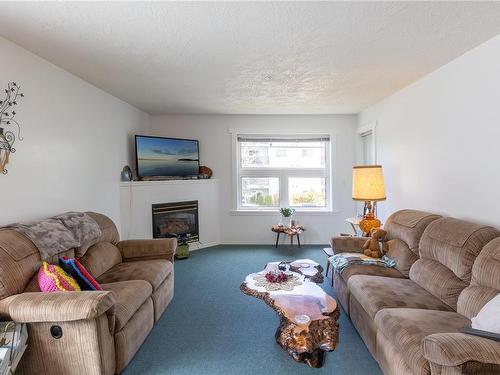 204-3855 11Th Ave, Port Alberni, BC - Indoor Photo Showing Living Room With Fireplace