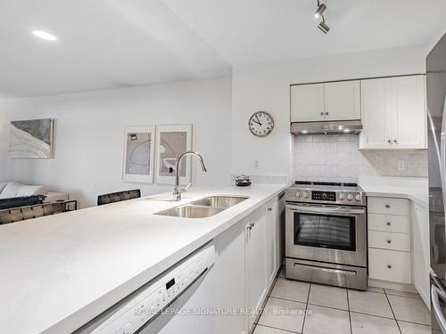 413-35 Kingsbridge Garden Circ, Mississauga, ON - Indoor Photo Showing Kitchen With Double Sink