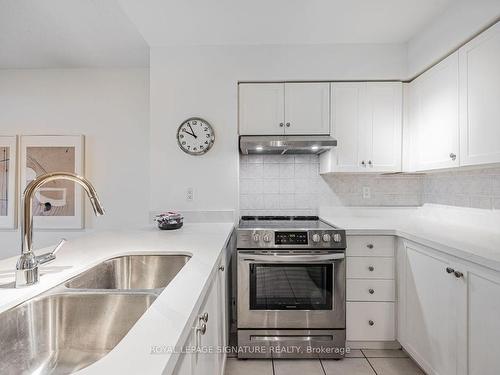 413-35 Kingsbridge Garden Circ, Mississauga, ON - Indoor Photo Showing Kitchen With Double Sink