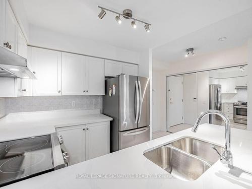 413-35 Kingsbridge Garden Circ, Mississauga, ON - Indoor Photo Showing Kitchen With Double Sink