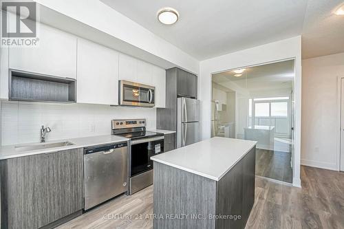 1310 - 202 Burnhamthorpe Road E, Mississauga, ON - Indoor Photo Showing Kitchen With Upgraded Kitchen