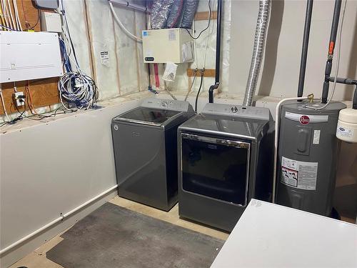 4 Ingstad Way, Brandon, MB - Indoor Photo Showing Laundry Room