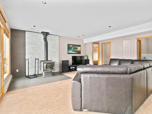 Family room - 11 346E Avenue, Saint-Hippolyte, QC - Indoor With Fireplace