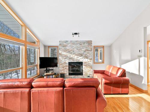 Living room - 11 346E Avenue, Saint-Hippolyte, QC - Indoor Photo Showing Living Room With Fireplace