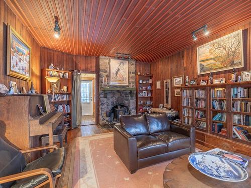 Aerial photo - 1044 Ch. Des Hauteurs, Saint-Hippolyte, QC - Indoor Photo Showing Living Room With Fireplace