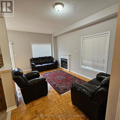 76 Rubysilver Drive, Brampton, ON - Indoor Photo Showing Living Room With Fireplace