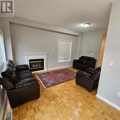 76 Rubysilver Drive, Brampton, ON - Indoor Photo Showing Living Room With Fireplace