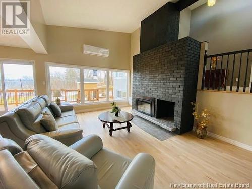 4 Athol Street, Campbellton, NB - Indoor Photo Showing Living Room With Fireplace