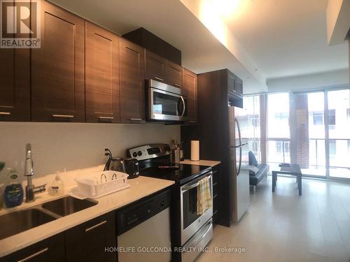 513 - 20 Bruyeres Mews, Toronto, ON - Indoor Photo Showing Kitchen With Double Sink With Upgraded Kitchen