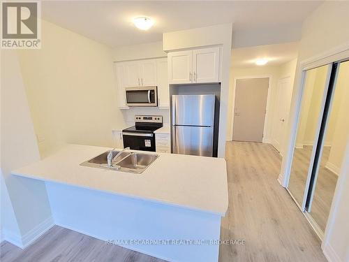 546 - 16 Concord Place, Grimsby, ON - Indoor Photo Showing Kitchen With Stainless Steel Kitchen With Double Sink